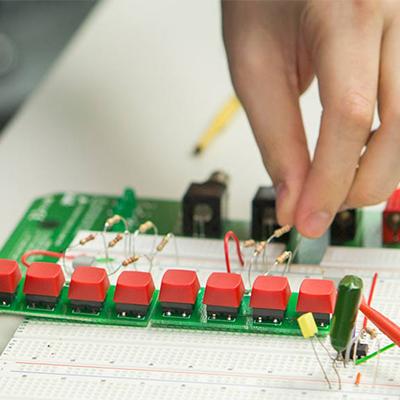 Student working with electrical wires.